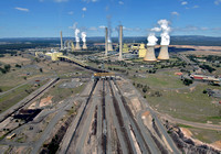 Aerial view of the Loy Yang Open cut mine and power staion showing  the drive train and conveyor system that carries the  brown coal to the  station