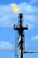 detail of a refinery flare-burning off excess pipeline gas