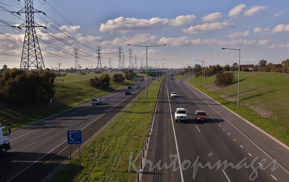 freeway light traffic with transmission towers running parallel9