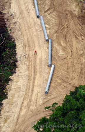 Papua New Guinea worker on pipeline