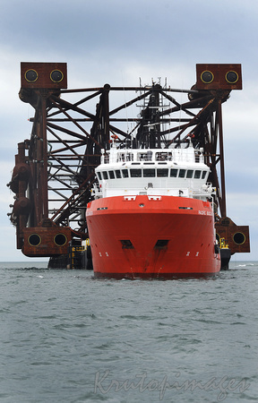 Platform jacket is towed out to sea