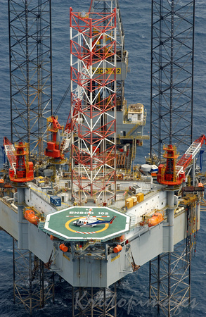 The Ensco 102 Jackup rig operating over with helicopter on helipad -Bass Strait0495