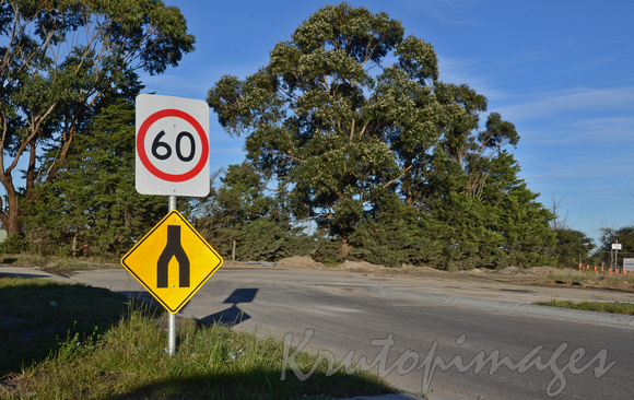 the end of a major road in suburban Melbourne with dual lanes signage going to one