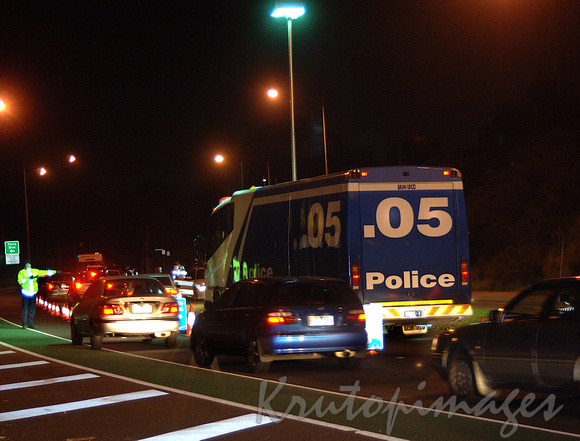 Booze Bus -Random breath test police vehicle on a major road at night-Melbourne