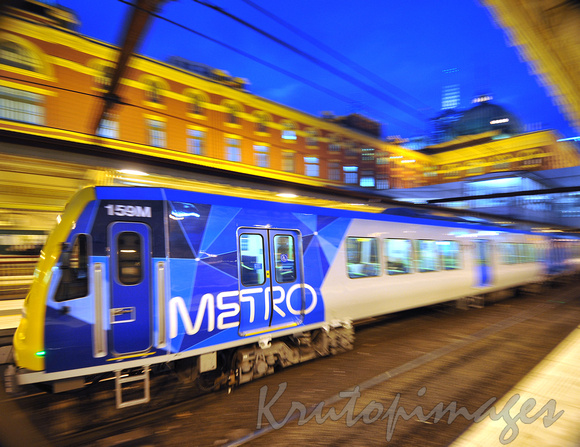 Finders Street Station Metro train leaving at night
