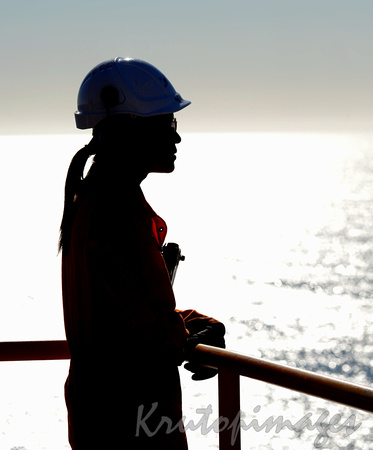 female engineer offshore worker silhouette