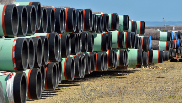 HUge pipes stacked in a refinery storage yard before transportaion to pipeline build in the southern Highlands PNG