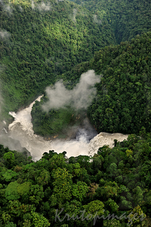 PNG-aerial view of rugged raging rivers and falls and dark forboding jungle in the highlands of Papua New Guinea