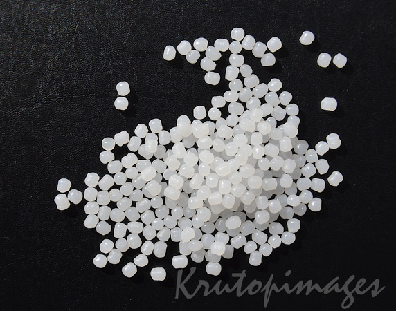 detail of polyethylene pellets used in extrusion manufacturing of plastics and polymers