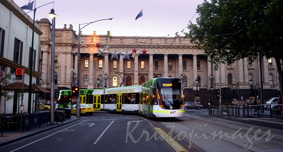 new Public Transport articulated tram passes Parliament House Spring Street Melbourne