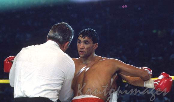 Jeff Fenech looking innocent gets a warning from the referee