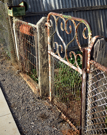 old rusted metal front gate