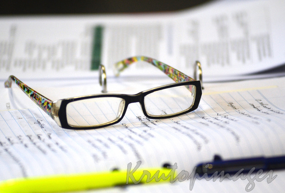 business glasses rest on documents during seminar