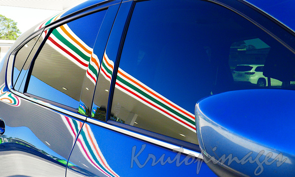 7 Eleven branding reflected on duco of vehicle filling upwith fuel