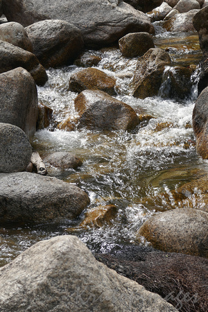 running water cascades through rocks.