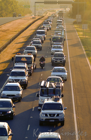 traffic crawls on the freeway to the outer suburbs in the heat