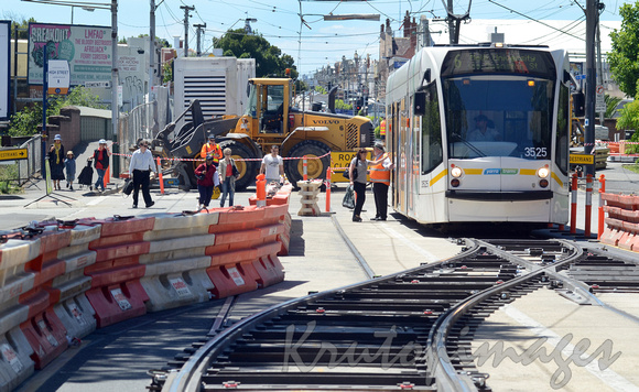 commuters enter the tram in a upgrade to tracks location -Armadale Melbourne