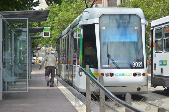 Tram stop in Melbourne CBD with elderley citizen on tram stop