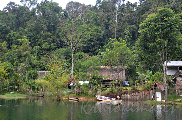 PNG- typical Huli farming village set around a lake in the highlands