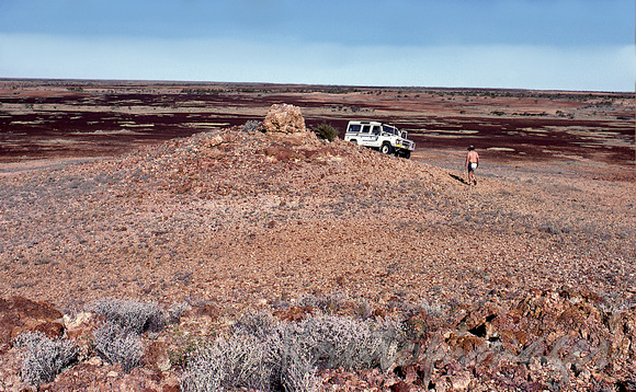 outback corner country South Australia-archaeologist walks to vehicle in the Simpson Deser