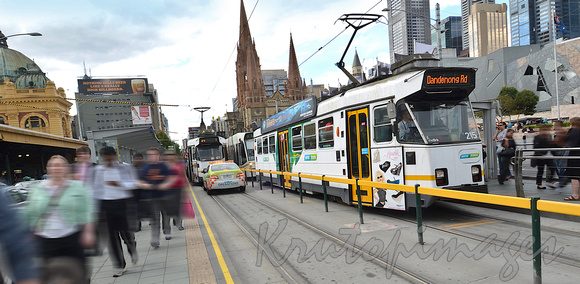 commuters at the busy Flinders Station Swanston stree tram stops-Melbourne