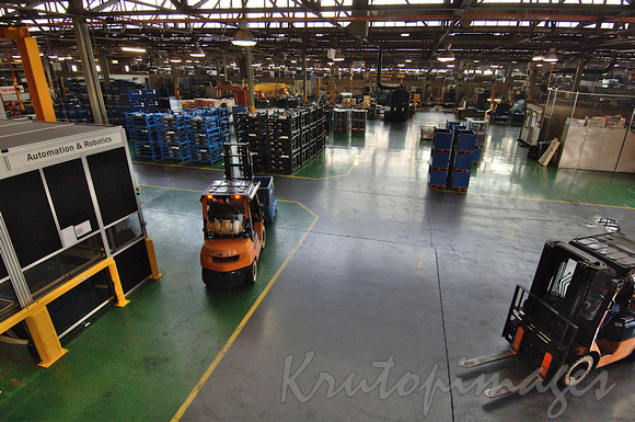 forklifts at work on factory floor