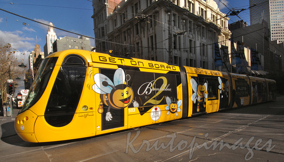 Yarra Trams Bumblebee tram brightly designed articulated public transport in Melbourne CBD