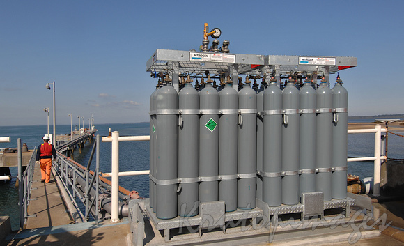 Nitrogen containers stand on the walkway at the Long Island Point jetty
