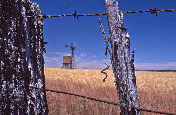 Rural New South Wales seen through an old barbed wire fence-2