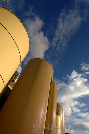 Paper manufacturing premise Norske Skog-exterior image showing storage silos and conveyor