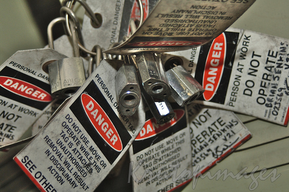 Danger warning -tags with locks for attaching to various machinery valves, switches etc during maintenance & upgrades