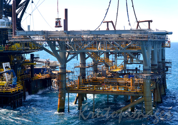 workers are transported to the topside section of an offshore platform lowered onto the jacket section -Bass Strait Australia-2