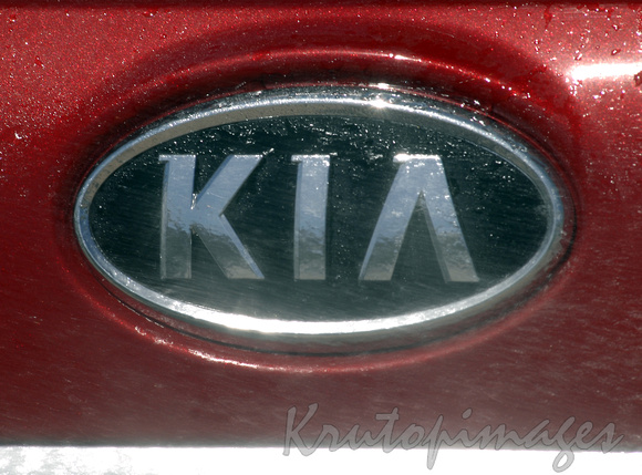 KIA badge on motor vehicles