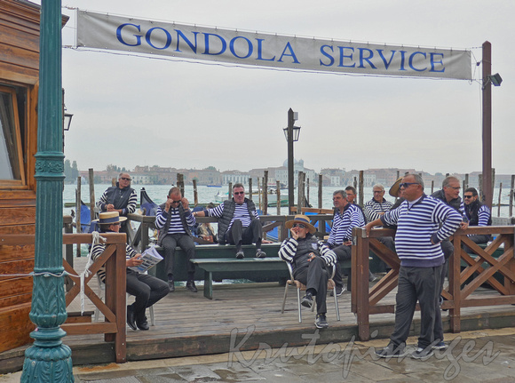 Venice, a union of gondoliers wait for passing trade