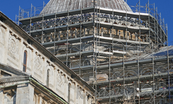 Pisa and surrounding buildings...maintenance happening on dome.