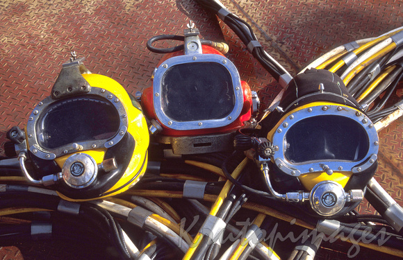 selection of divers masks on the deck pf an offshore platform