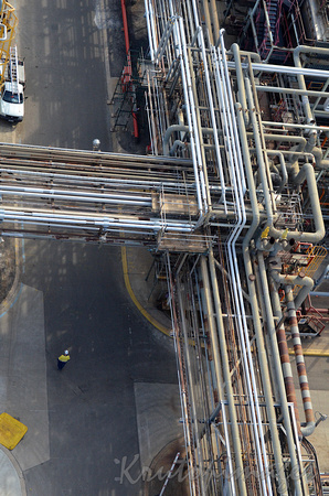 overhead view of a construction worker at a refinery