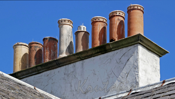 Invergordon-chimney tops of various types and condition on the roofs of the homes in town
