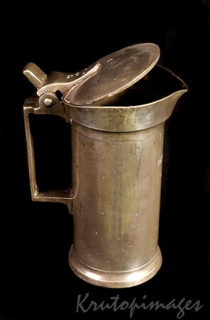 Old Pewter drinking vessel with opening lid