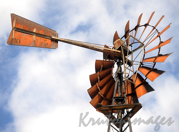 Australian Southern Cross windmills stand in a paddock