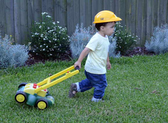 little worker-child-Oscar with the mower