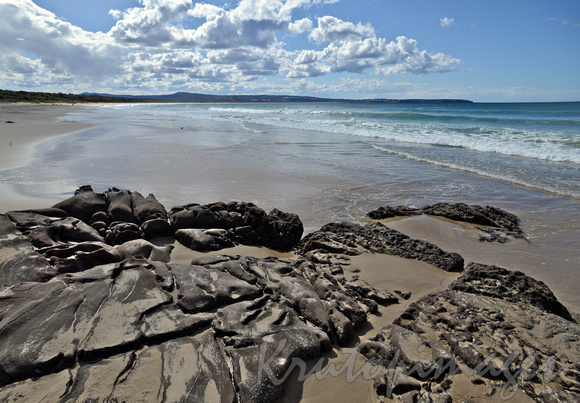 Pambula NSW  beach and rocky formations creating small pools