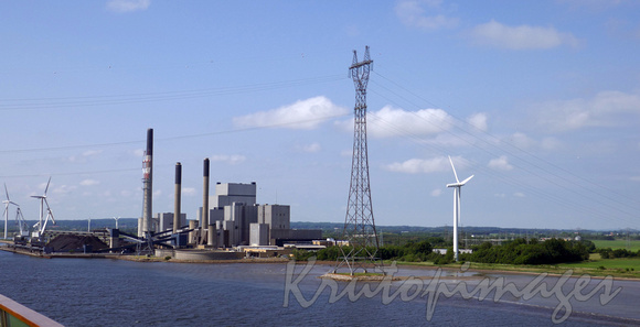 Coal fired power plant, wind turbines and transmission lines at Aalsborg Germany Aalborg.