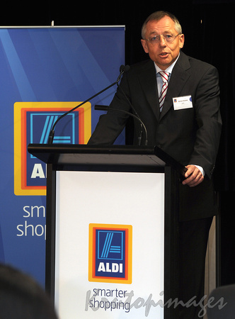 Aldi CEO Michael Kloester behind the podium.
