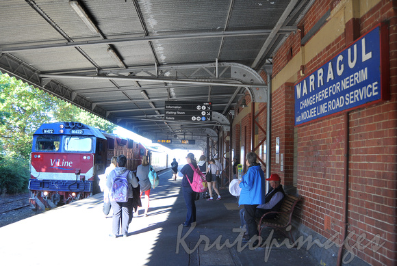 Warragul rail station passengers,platform and train.