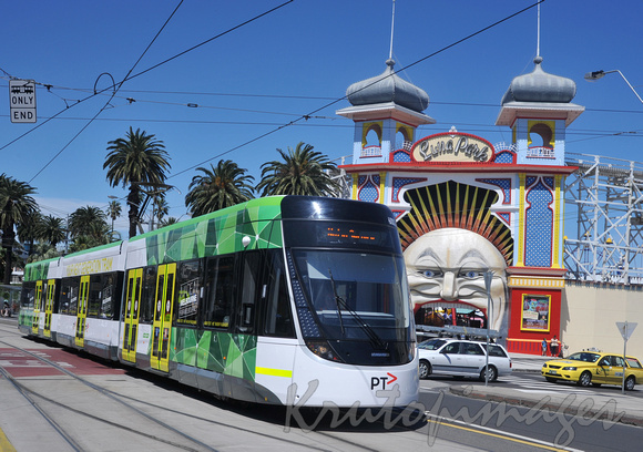 Public tram passes st Kilda Luna Park