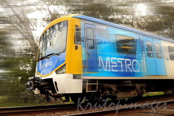 Metro train speeds past -blur