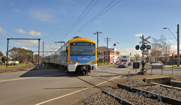 Metro Train crosses the level crossing in Pakenham Victoria