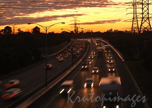 Freeway traffic heading out of the city at sunset Melbourne-2