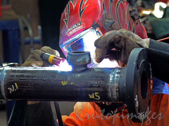 welder at work close up detail gloved hand
